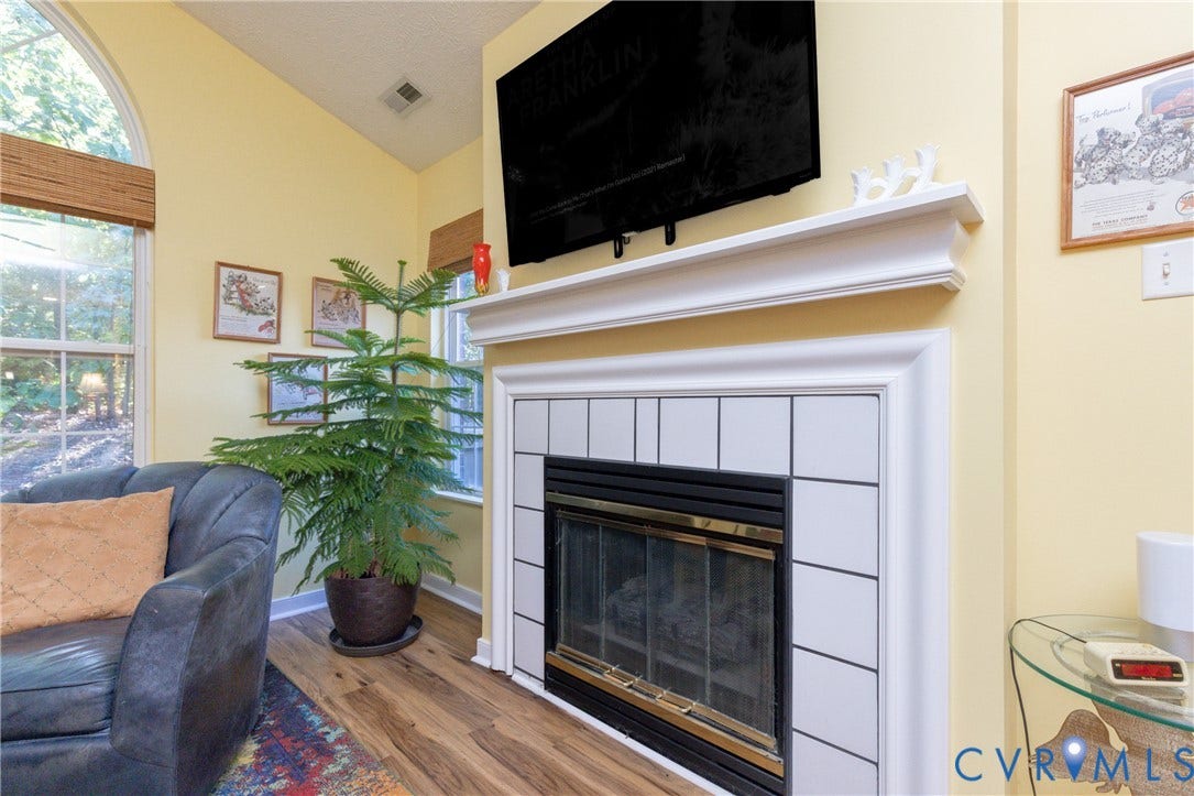 Fireplace with white tile surround