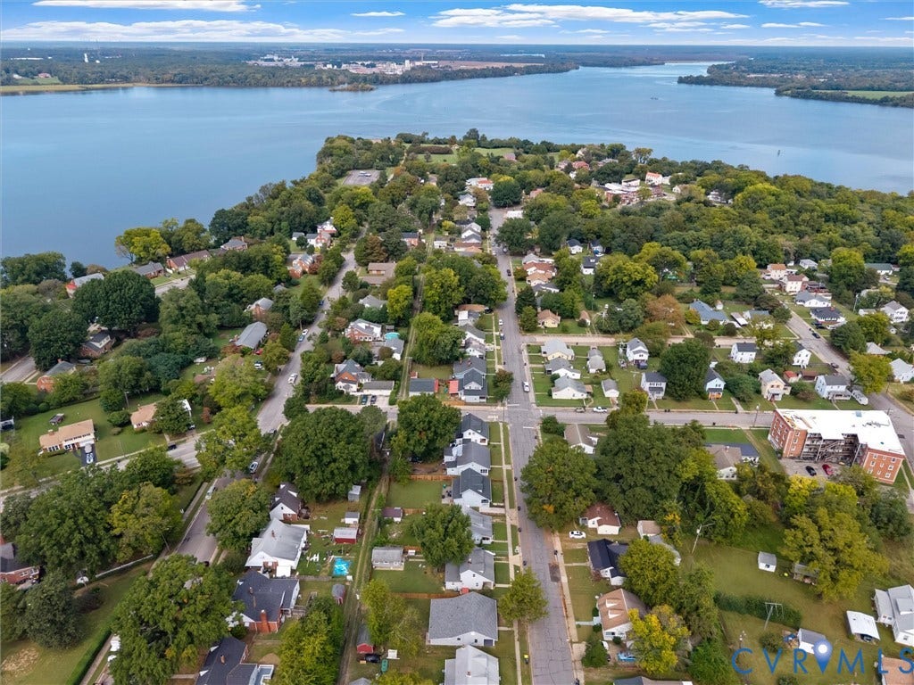 Waterfront community with mature trees and established residential streets