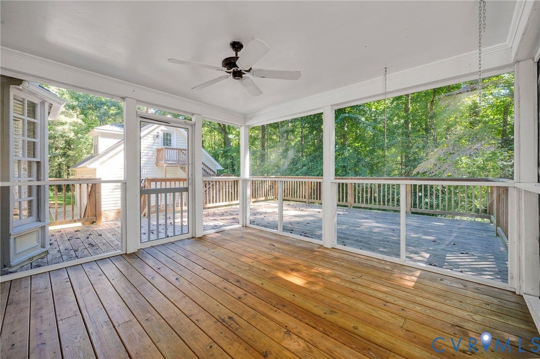 10303 Silverbrook Drive, Henrico, VA 23233 Screened porch with wood-finish flooring, white ceiling fan, and access to an exterior wood deck