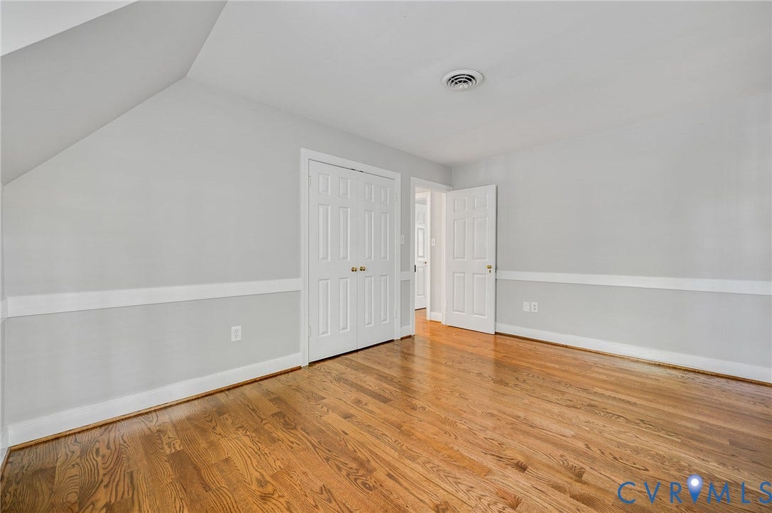 10303 Silverbrook Drive, Henrico, VA 23233 Hardwood flooring throughout, featuring a two-tone wall treatment with a chair rail accent