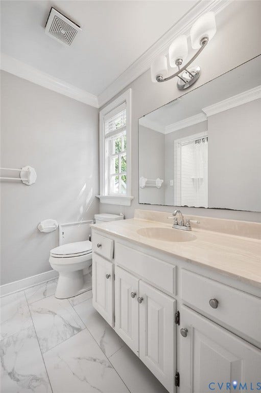 10303 Silverbrook Drive, Henrico, VA 23233 White vanity with integrated sink, rectangular wall mirror, and modern three-bulb fixture