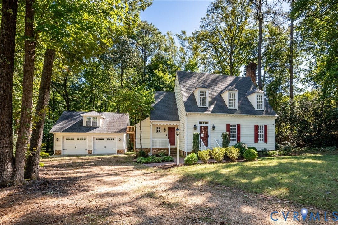 10303 Silverbrook Drive, Henrico, VA 23233 Cape Cod style residence featuring dormer windows, red shutters, and a covered front porch