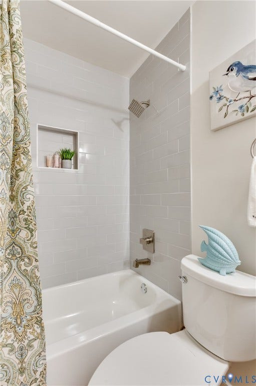 8010 Callison Drive, Glen Allen, VA 23060 Bathtub with subway tile surround, recessed shower niche, and brushed nickel fixtures