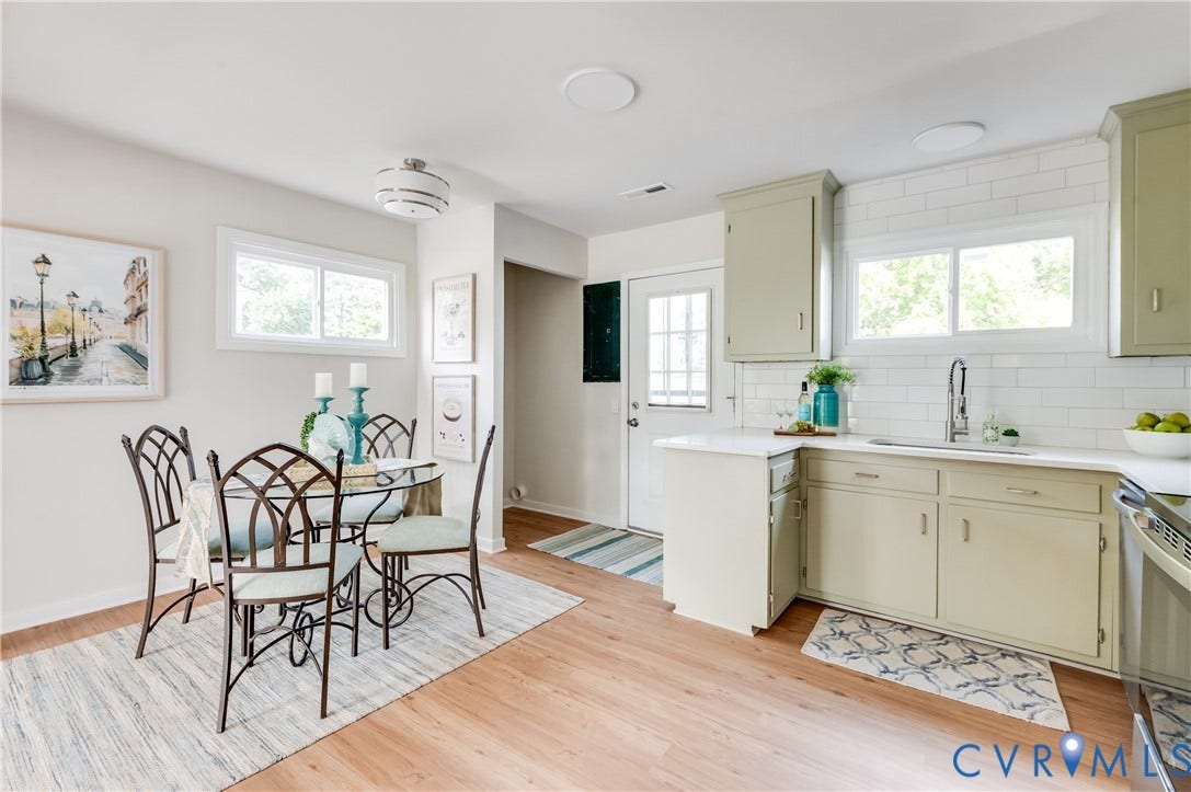 8010 Callison Drive, Glen Allen, VA 23060 Light-toned wood-finish flooring, white subway tile backsplash, light-colored cabinetry, and white countertops