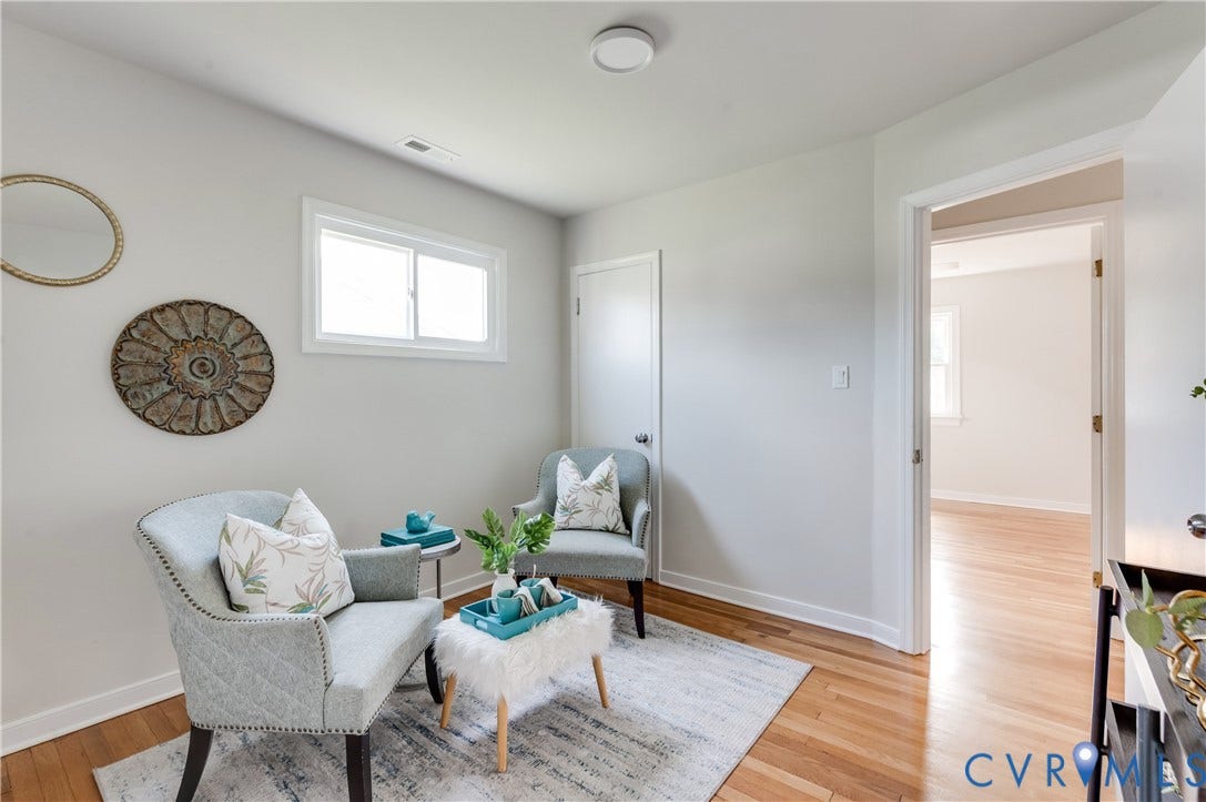 8010 Callison Drive, Glen Allen, VA 23060 Hardwood flooring, light gray wall finishes, white trim, and a built-in overhead light fixture