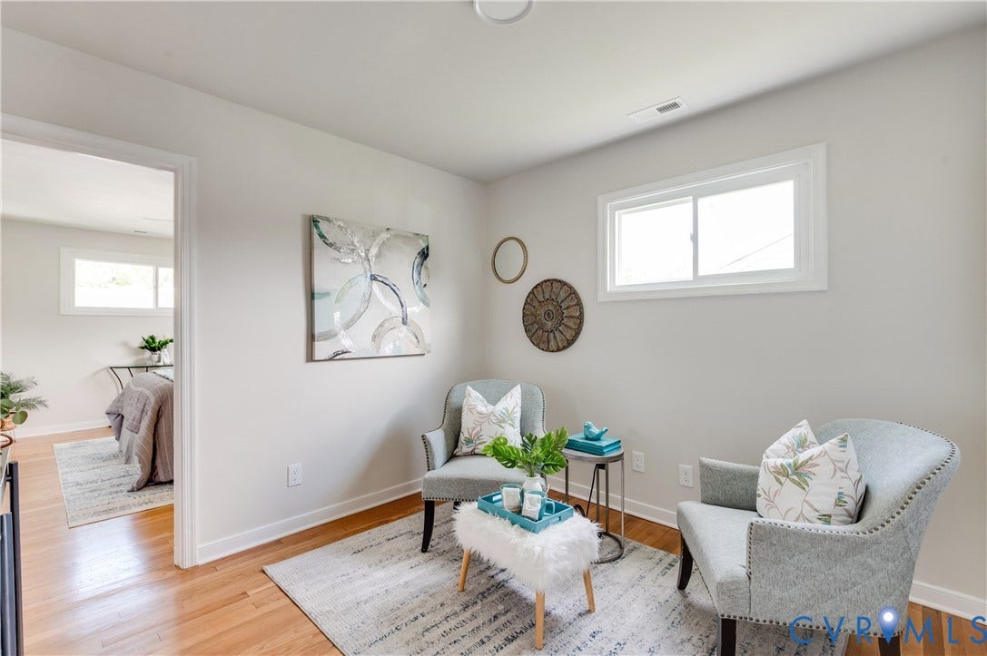 8010 Callison Drive, Glen Allen, VA 23060 Hardwood flooring, painted interior walls, white trim, and a window for natural light