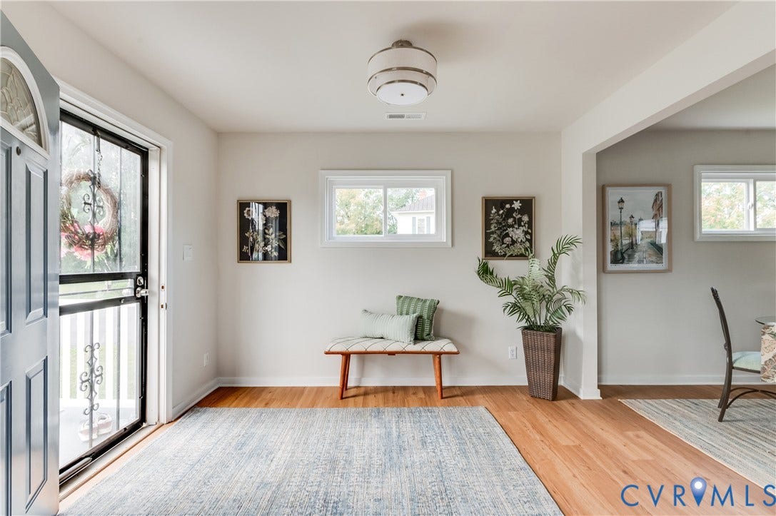 8010 Callison Drive, Glen Allen, VA 23060 Hardwood-style flooring with a decorative ceiling light fixture