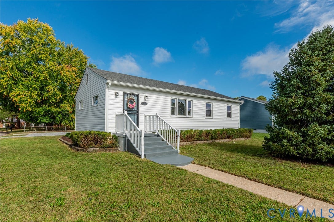 8010 Callison Drive, Glen Allen, VA 23060 Siding exterior with a gable roof, concrete walkway, and landscaped shrubbery