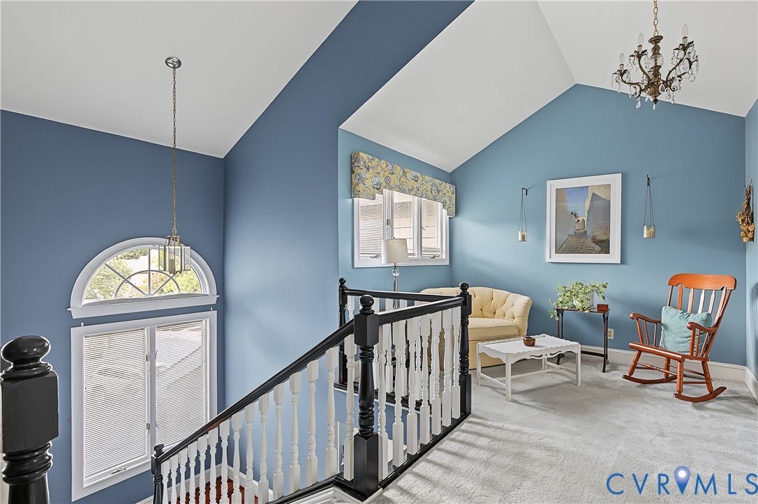 3131 Stony Point Road, #B, Richmond, VA 23235 Vaulted ceiling with a chandelier, half-round transom window, and a white baluster staircase