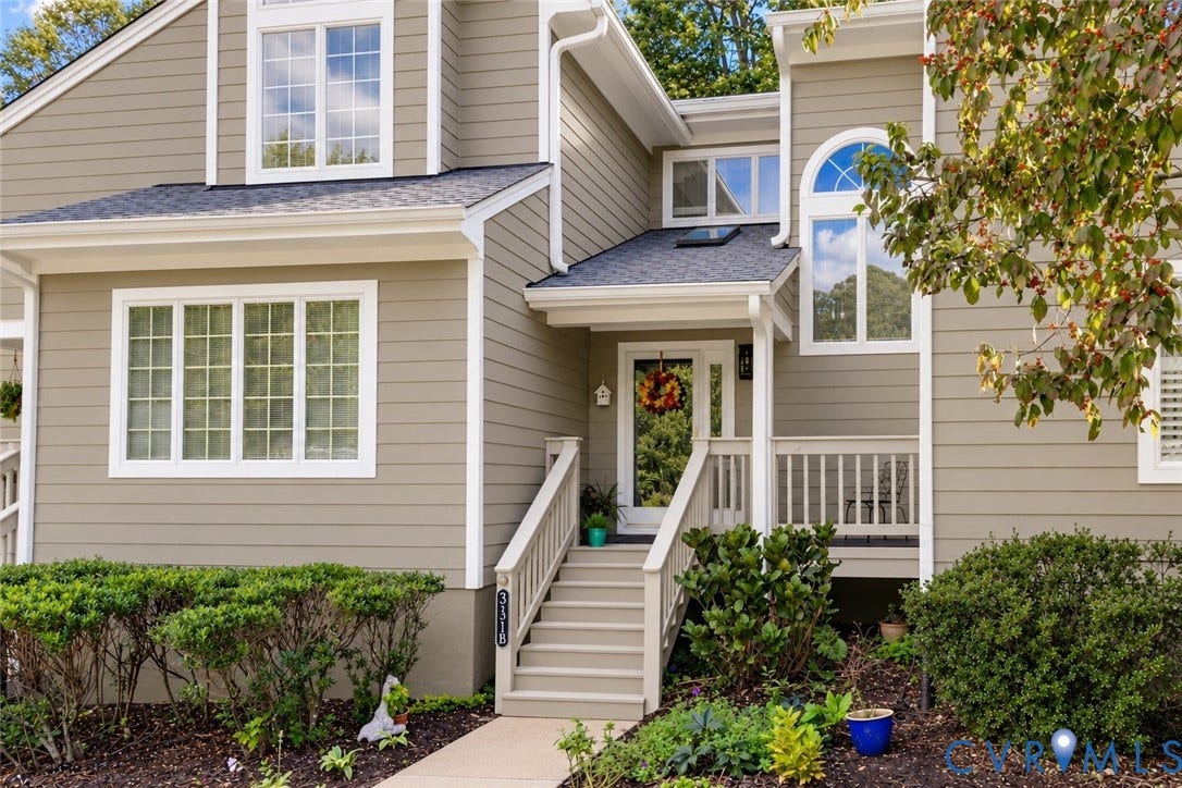 3131 Stony Point Road, #B, Richmond, VA 23235 Multi-level exterior with neutral siding, white trim, and a prominent arched window