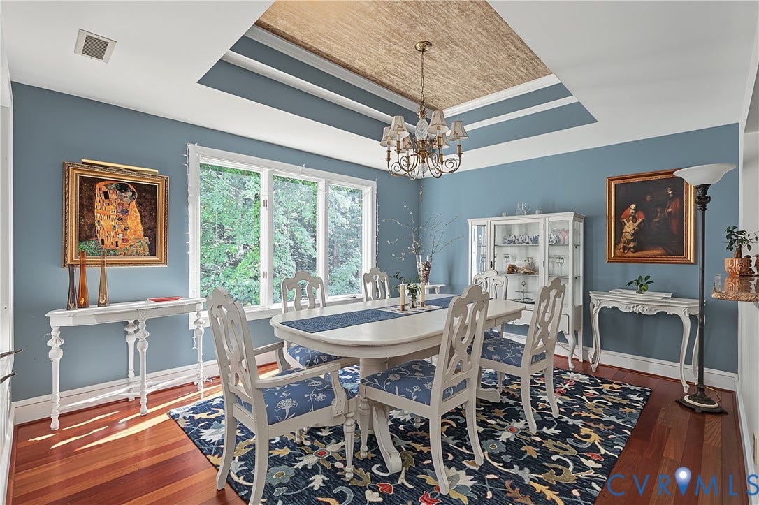 3131 Stony Point Road, #B, Richmond, VA 23235 Tray ceiling with textured inset, chandelier, expansive windows, wood-finish flooring, and white built-in cabinetry