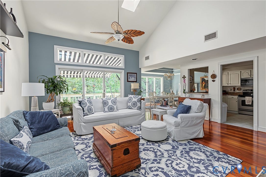 3131 Stony Point Road, #B, Richmond, VA 23235 Vaulted ceiling with an overhead fan, rich wood-finish flooring, and sliding glass doors with transom windows