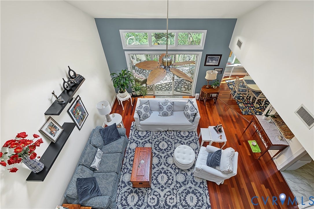 3131 Stony Point Road, #B, Richmond, VA 23235 Soaring vaulted ceilings with a ceiling fan, expansive windows, wood-finish flooring, and built-in wall shelving