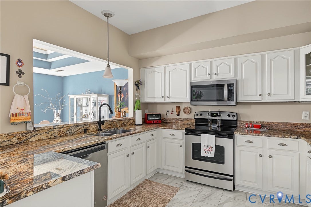 3131 Stony Point Road, #B, Richmond, VA 23235 Kitchen with white cabinetry, granite countertops, stainless steel appliances, and a pass-through window