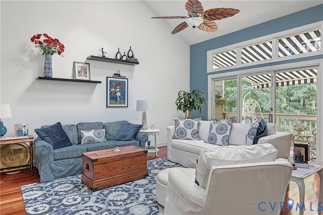 3131 Stony Point Road, #B, Richmond, VA 23235 Vaulted ceiling with an overhead fan, hardwood flooring, sliding glass door with transom windows, and built-in wall shelving