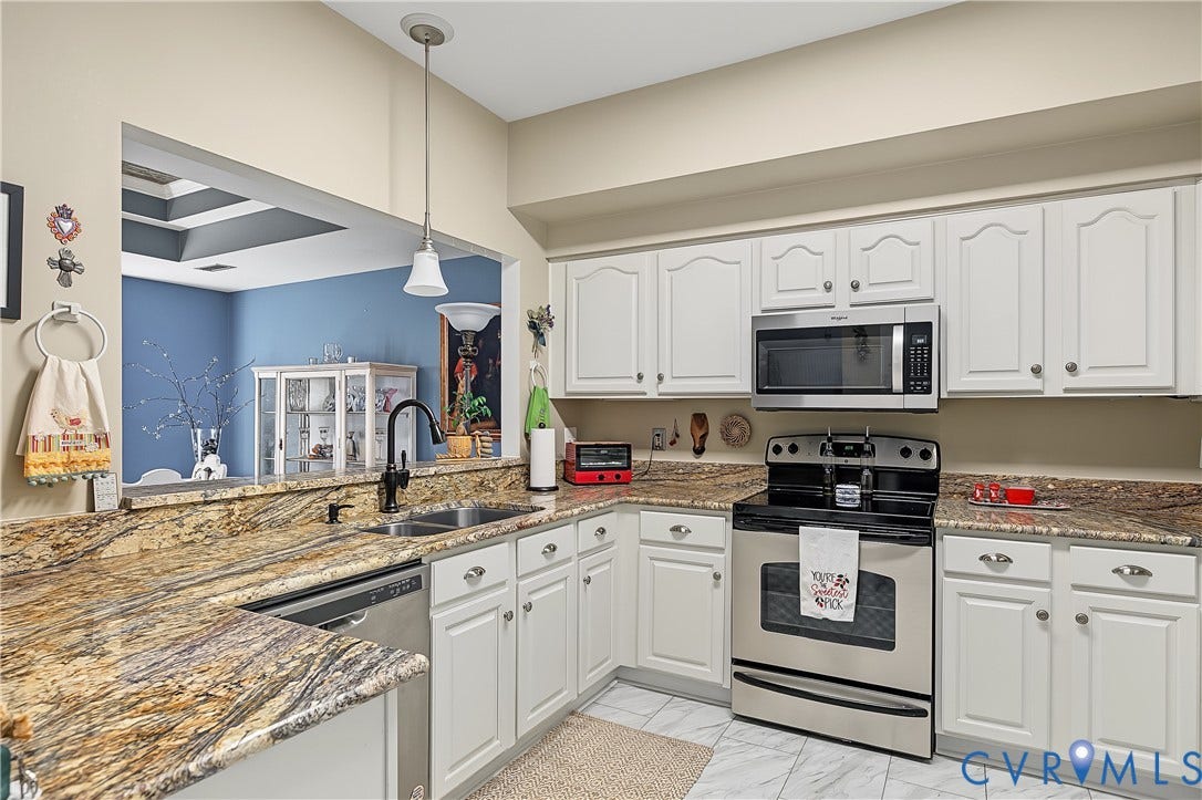 3131 Stony Point Road, #B, Richmond, VA 23235 Kitchen featuring white cabinetry, stone-finish countertops, stainless steel appliances, and a pass-through opening
