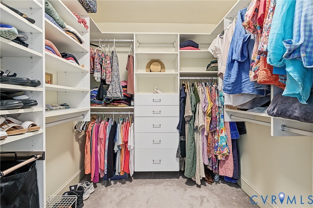 3131 Stony Point Road, #B, Richmond, VA 23235 Custom closet system featuring white built-in shelving, multiple hanging rods, and integrated drawer storage