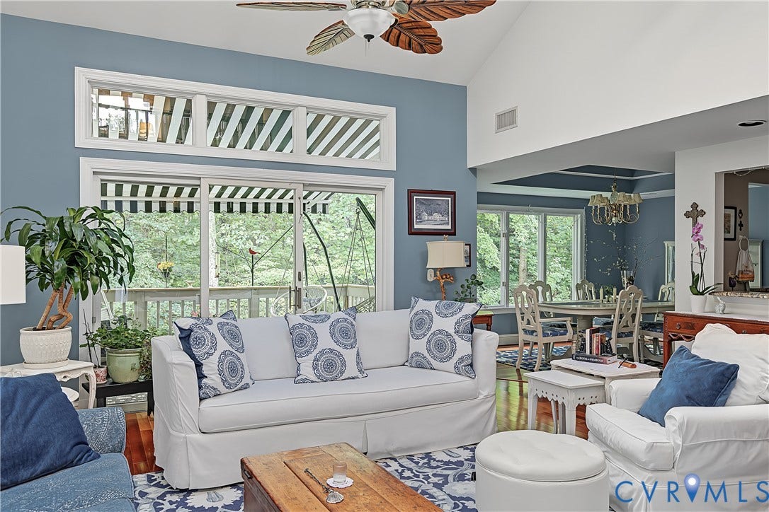 3131 Stony Point Road, #B, Richmond, VA 23235 Vaulted ceilings, wood-finish flooring, sliding glass doors, upper transom windows, and a decorative ceiling fan