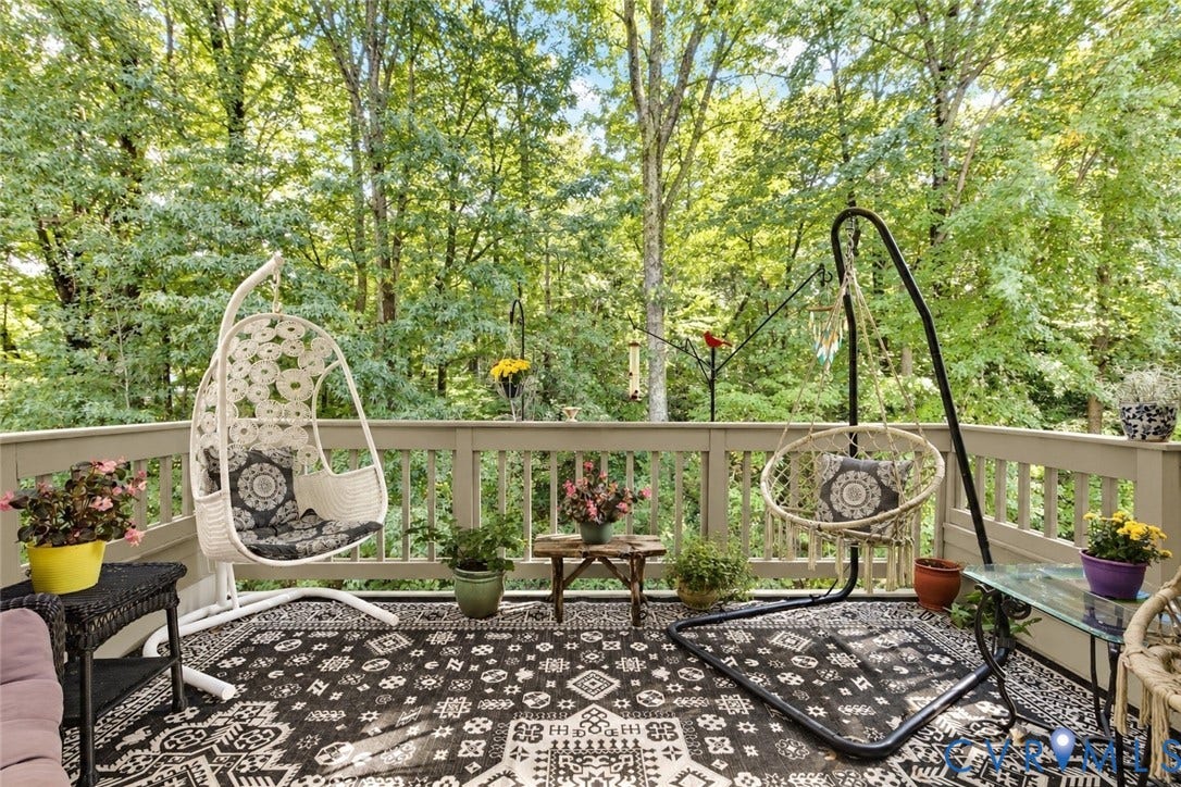 3131 Stony Point Road, #B, Richmond, VA 23235 Wood-finish deck with a perimeter railing and expansive tree-line backdrop