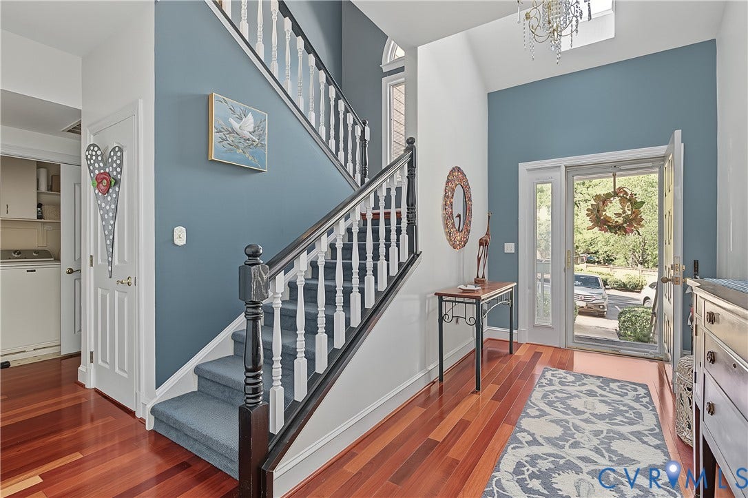 3131 Stony Point Road, #B, Richmond, VA 23235 Hardwood flooring, two-story foyer, transom window, white trim, and a built-in staircase