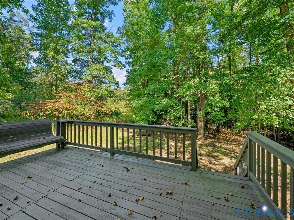 Back Deck located directly off the Primary Bedroom.  (Picture has been edited to remove Chicken Coop in backyard)