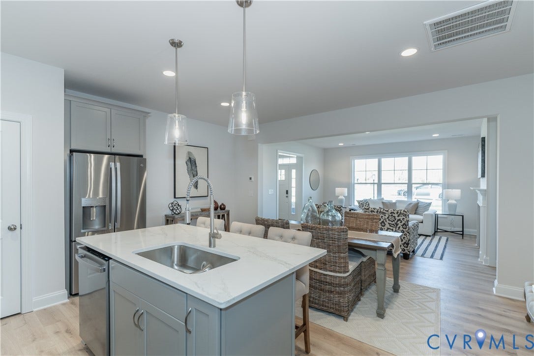 Photos of a similar home in the community. Optional features and finished may be demonstrated.