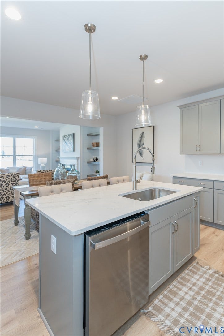 Photos of a similar home in the community. Optional features and finished may be demonstrated.