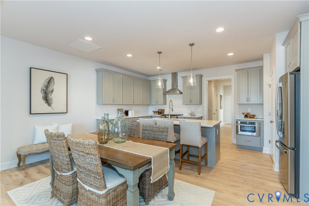 Photos of a similar home in the community. Optional features and finished may be demonstrated.