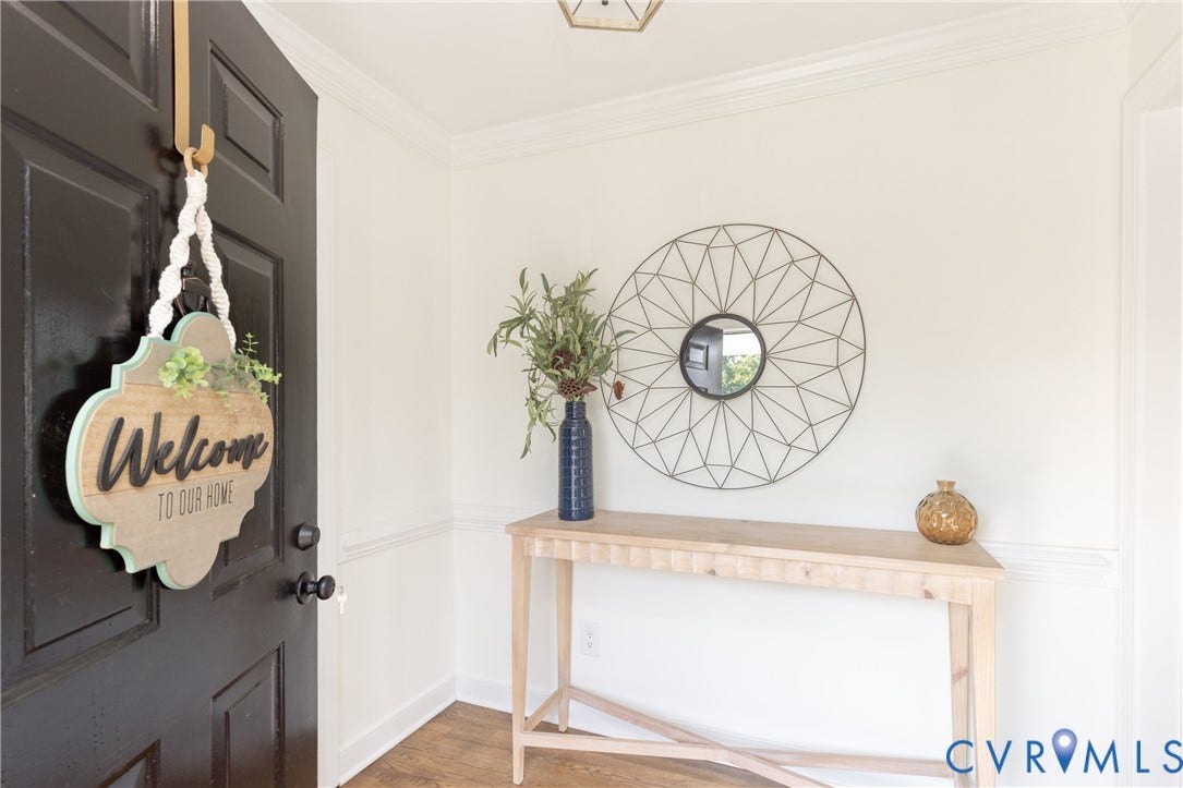 Crown molding details, chair rail molding, and wood-finish flooring