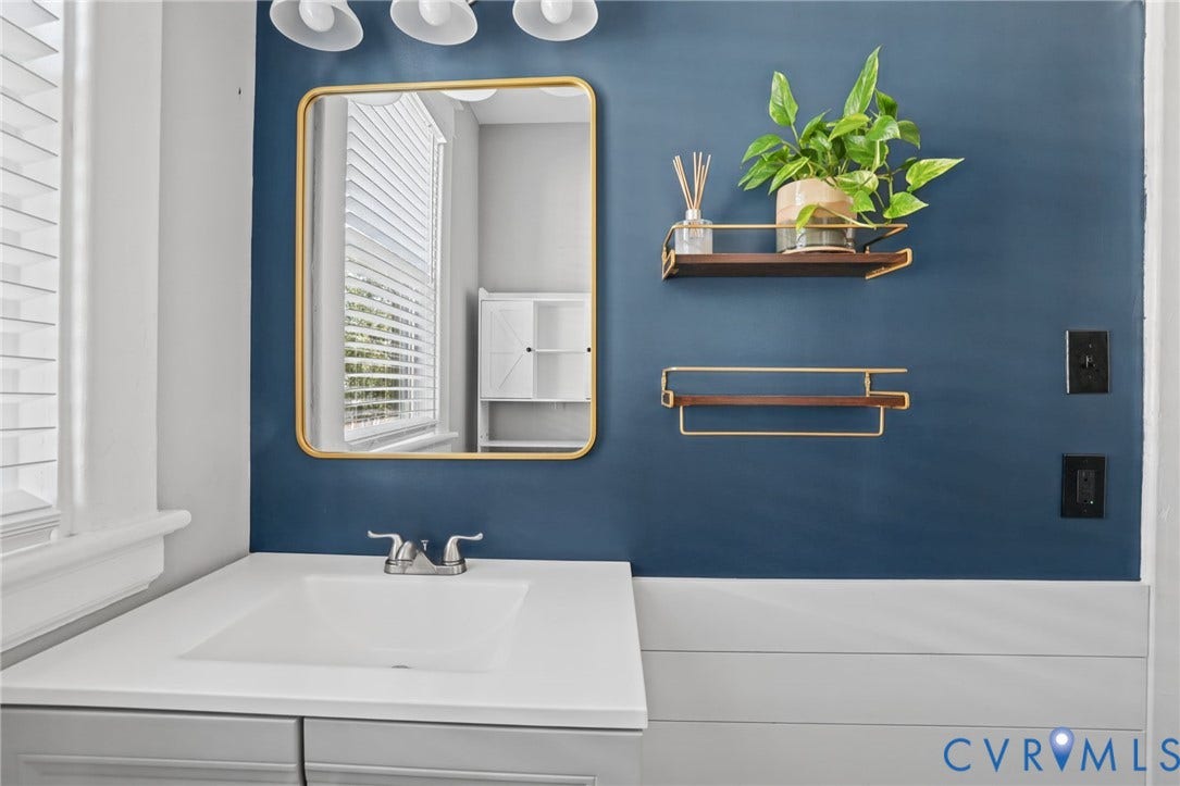 Integrated vanity with an undermount sink and polished chrome faucet