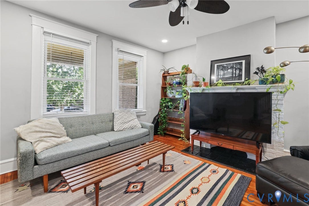 Hardwood flooring, painted walls, white trim, recessed lighting, and a ceiling fan