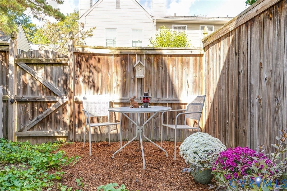 Rear gate to green spaces between homes