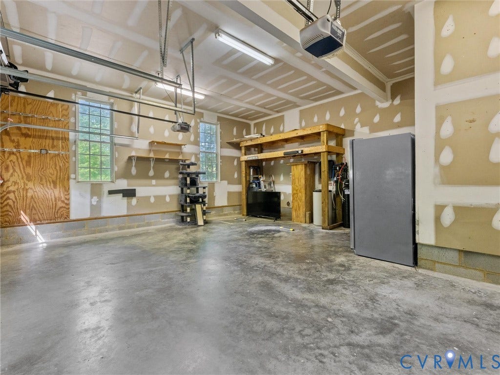 Concrete flooring with exposed ceiling joists