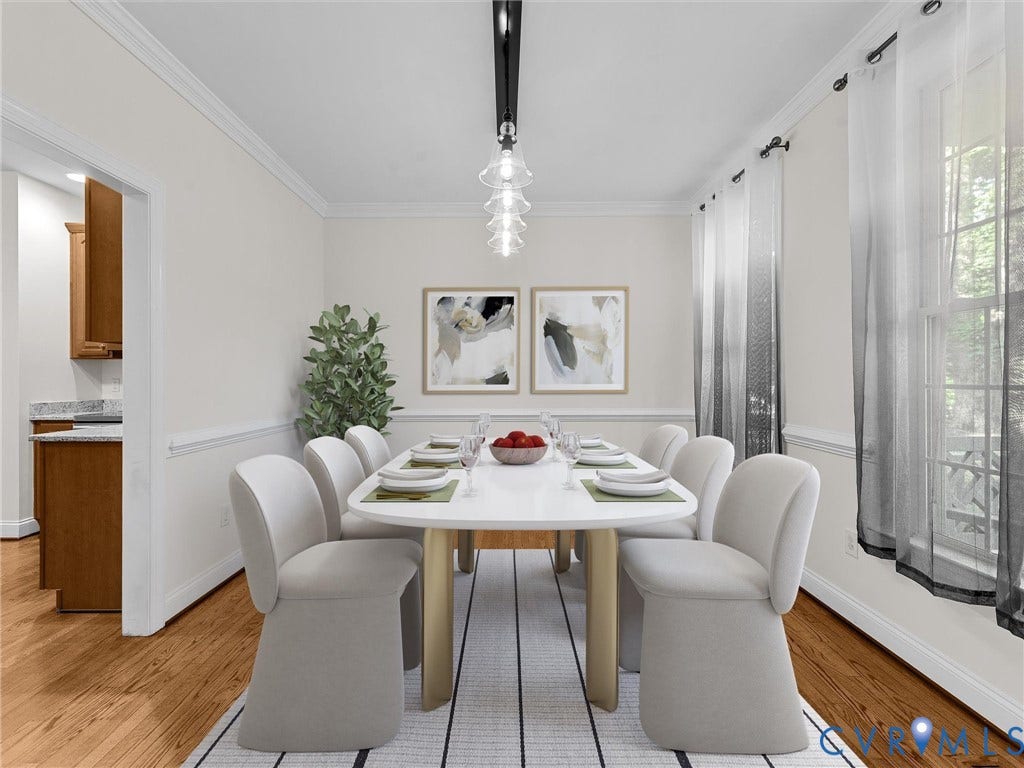 Formal dining space featuring hardwood flooring, crown molding, and a contemporary linear chandelier