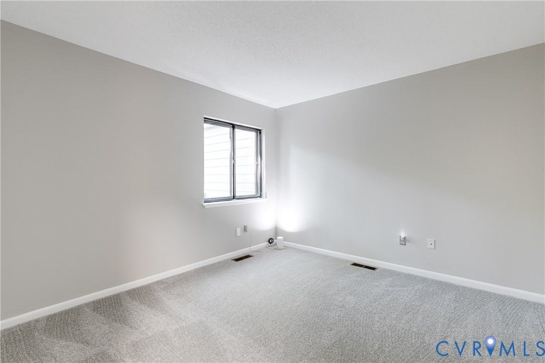 First floor bedroom with new carpet and fresh paint.