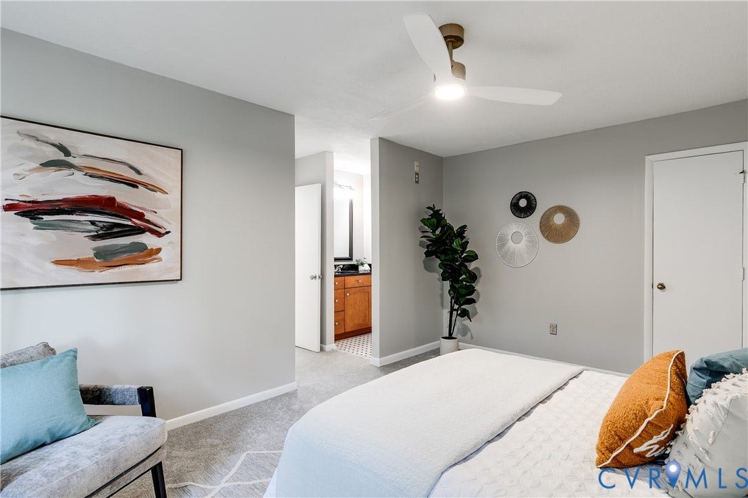 New ceiling fan and one of two entries to ensuite bath.