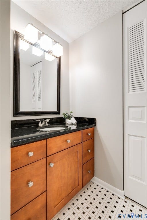 One side has a private sink and linen closet