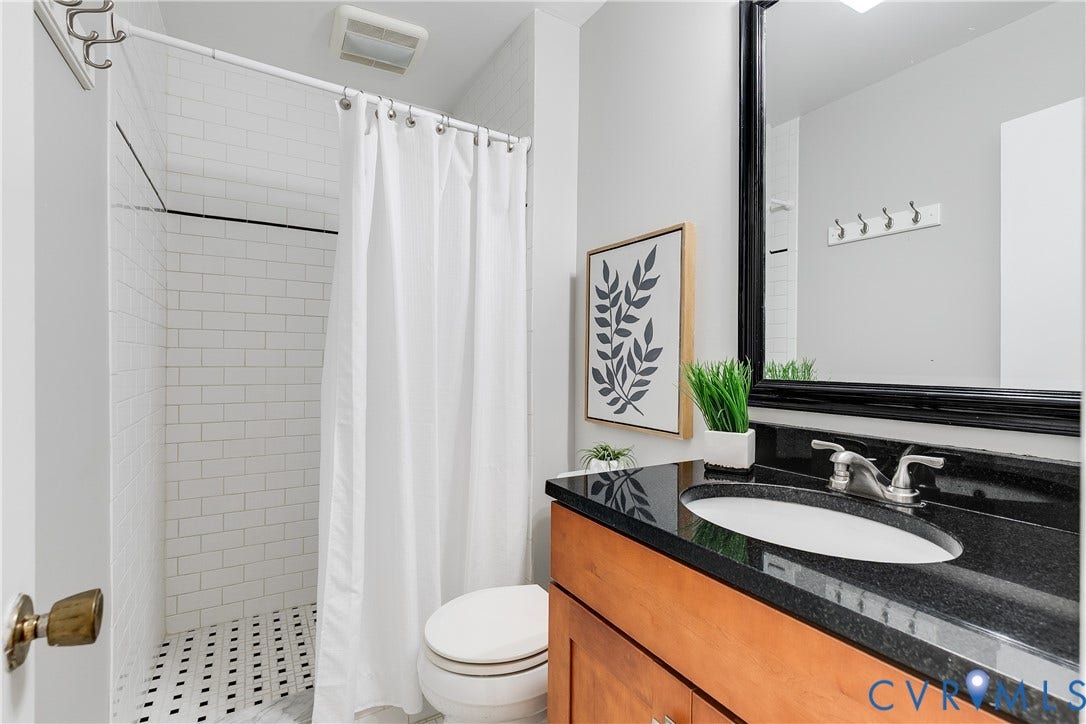 The other side has a walk in shower, toilet and private sink.