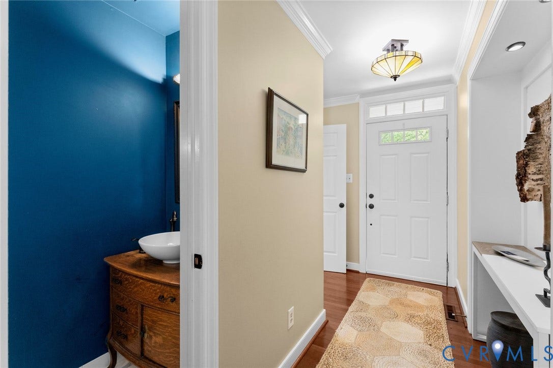 606 Westham Woods Drive, Tuckahoe, Henrico, VA 23229 Entryway featuring wood-finish flooring, a paneled front door with transom window, and crown molding