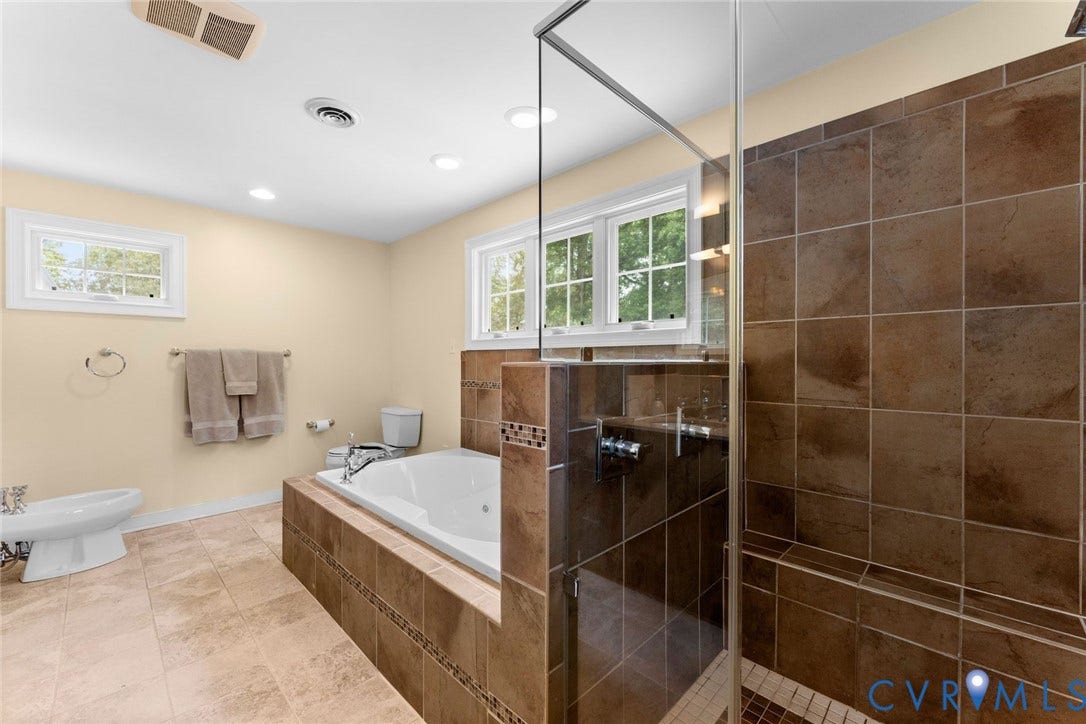606 Westham Woods Drive, Tuckahoe, Henrico, VA 23229 Tiled walk-in shower with a built-in bench, glass enclosure, and mosaic tile accents