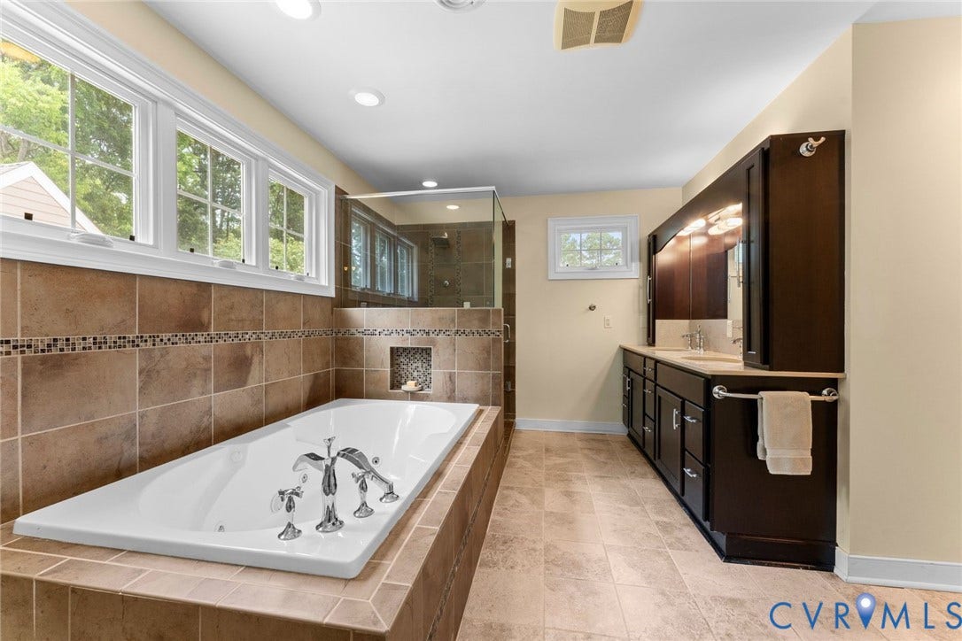 606 Westham Woods Drive, Tuckahoe, Henrico, VA 23229 Built-in soaking tub with chrome fixtures, glass-enclosed shower, dual vanity with undermount sinks, and tile flooring