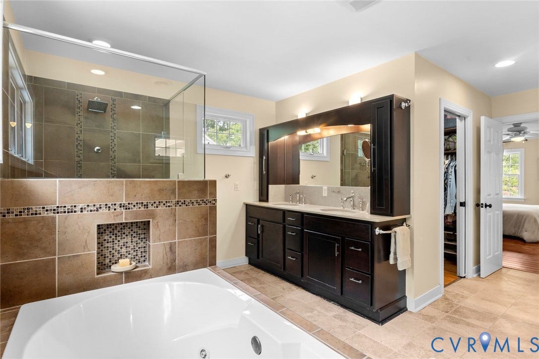 606 Westham Woods Drive, Tuckahoe, Henrico, VA 23229 Tile flooring extending to a built-in tub and shower with glass enclosure