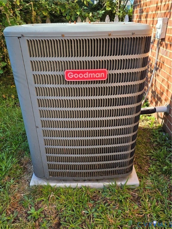 Goodman air conditioning unit on a concrete pad