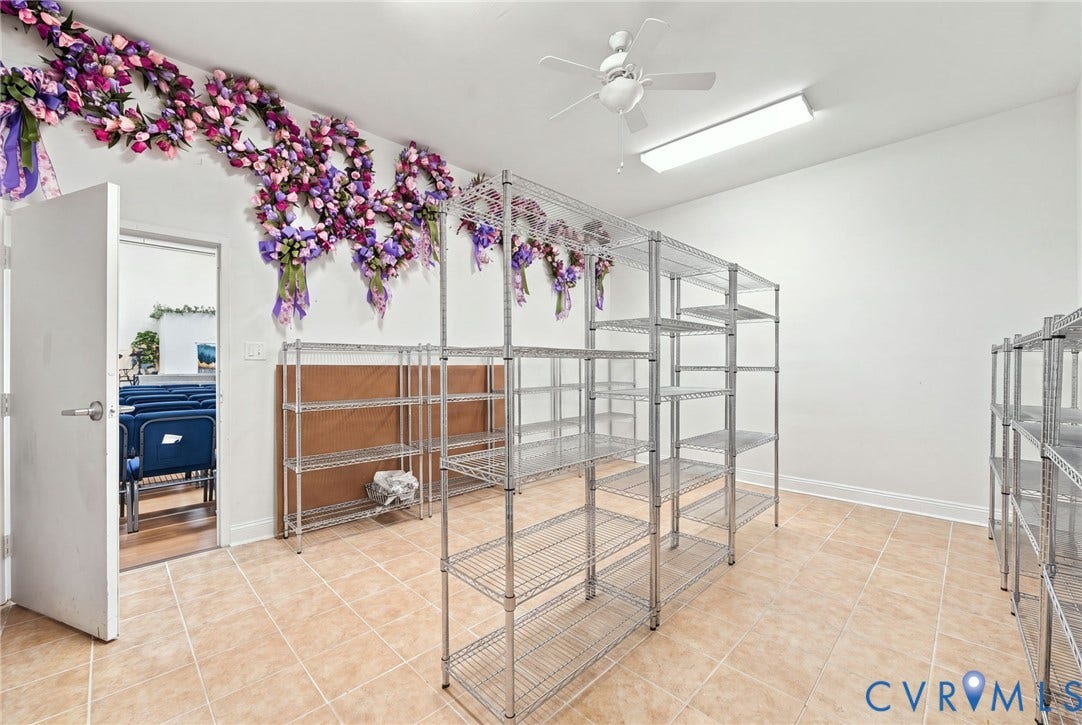 Tiled flooring, white walls, and a ceiling fan with integrated lighting