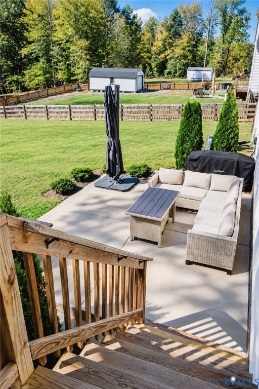 6265 Bushnell Drive, Rochambeau Estates, New Kent, VA 23124 Expansive backyard with a manicured lawn, wood fencing, and mature trees