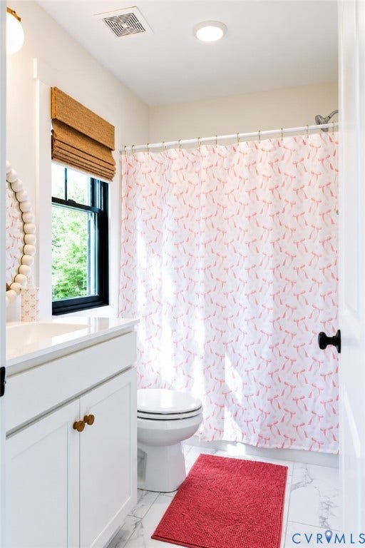 6265 Bushnell Drive, Rochambeau Estates, New Kent, VA 23124 White vanity with brass hardware, undermount sink, and recessed lighting