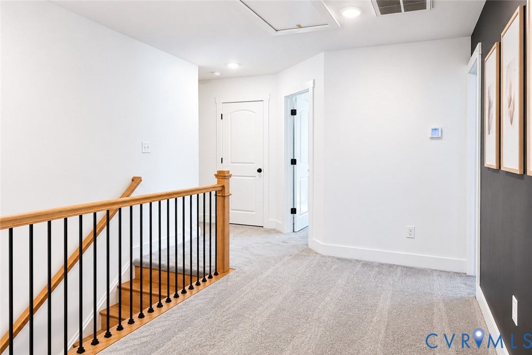 6265 Bushnell Drive, Rochambeau Estates, New Kent, VA 23124 Upper-level landing with light-toned carpeting and recessed lighting