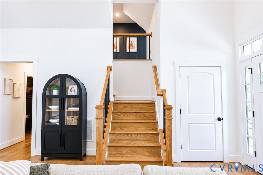 6265 Bushnell Drive, Rochambeau Estates, New Kent, VA 23124 Hardwood staircase with natural wood treads and black balusters