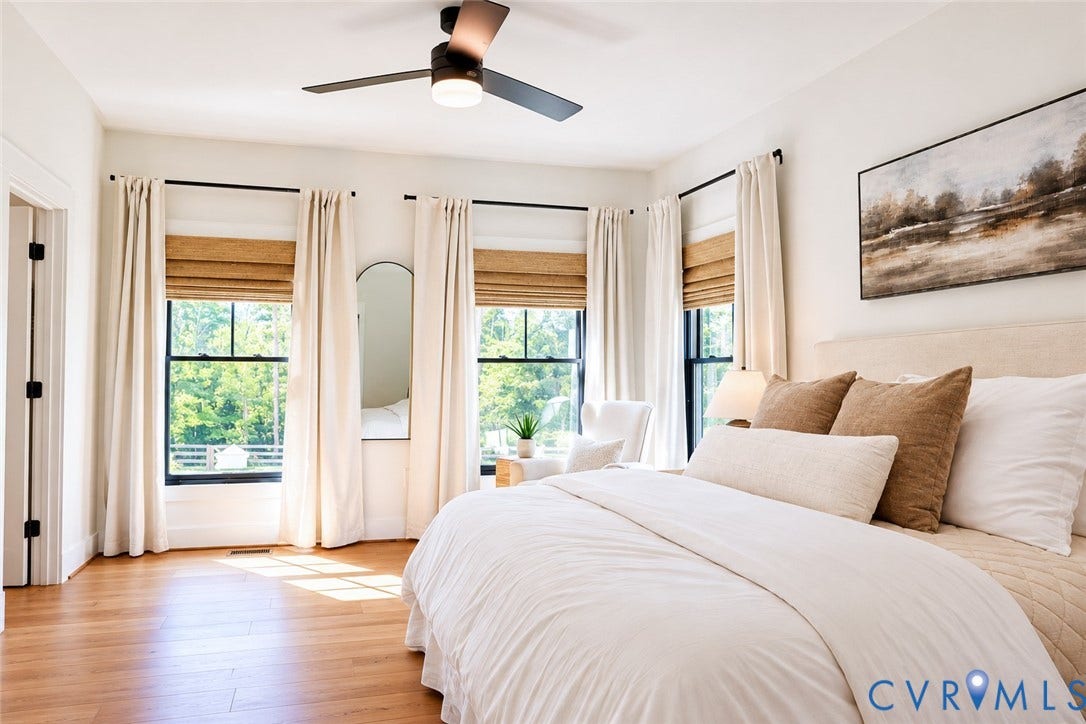 6265 Bushnell Drive, Rochambeau Estates, New Kent, VA 23124 Hardwood flooring, recessed lighting, modern ceiling fan, black-framed windows, and an upholstered headboard