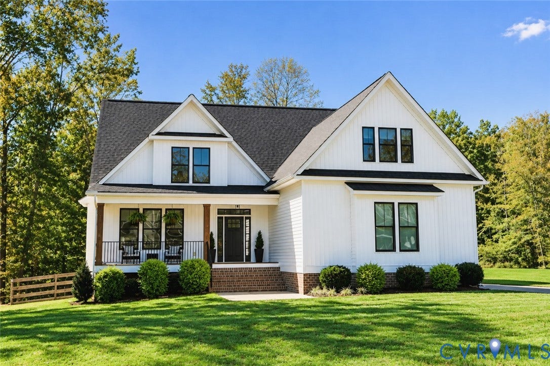 6265 Bushnell Drive, Rochambeau Estates, New Kent, VA 23124 Modern Farmhouse exterior with white board and batten siding, dark framed windows, a covered front porch, and a dark shingle roof